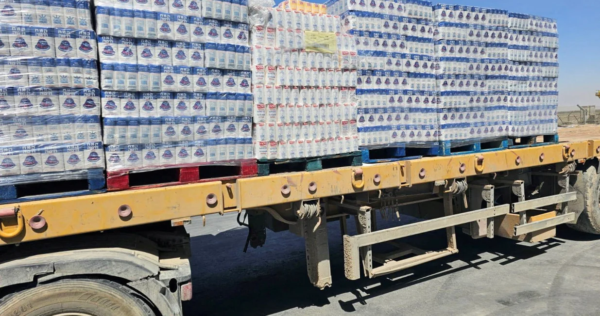 A truck loaded with aid is seen at the Kerem Shalom crossing between Israel and Gaza, on its Israeli side in this handout image obtained by Reuters on May 20, 2025. COGAT/Handout via REUTERS THIS IMAGE HAS BEEN SUPPLIED BY A THIRD PARTY/Cogat