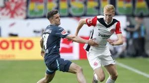 Soccer Football - Bundesliga - Eintracht Frankfurt v RB Leipzig - Deutsche Bank Park, Frankfurt, Germany - April 26, 2025 Eintracht Frankfurt's Hugo Larsson in action with RB Leipzig's Christoph Baumgartner REUTERS/Heiko Becker DFL REGULATIONS PROHIBIT ANY USE OF PHOTOGRAPHS AS IMAGE SEQUENCES AND/OR QUASI-VIDEO.