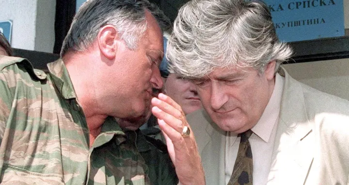 epa08529962 (FILE) - Republika Srpska leader Radovan Karadzic (R) listens to VRS Commander Ratko Mladic (L) during a meeting in Pale, Bosnia and Herzegovina, 05 August 1993 (reissued 06 July 2020). A quarter of a century ago, the world witnessed the worst mass murder on European soil since World War II. Some 7,000-8,000 Bosniaks were slaughtered and 20,000 civilians were forcibly displaced in an act of ethnic cleansing perpetrated in the small eastern Bosnian village of Srebrenica, whose name will forever be linked to the infamous 1995 massacre. Today, 25 years after the massacre, the memory of its victims is kept alive by several institutions, such as the Museum of Crimes Against Humanity and Genocide in Sarajevo or a permanent exhibit at the 'Memorial Center Srebrenica-Potocari' that now occupies the former headquarters of the Dutch UNPROFOR Battalion. EPA/STRINGER ATTENTION: This Image is part of a PHOTO SET *** Local Caption *** 02761942/Stringer