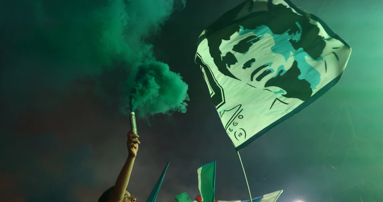 Soccer Football - Serie A - Napoli fans gather to watch Napoli v Cagliari - Naples, Italy - May 23, 2025 Napoli fans celebrate their second goal scored by Romelu Lukaku as they watch the match in the Piazza del Plebiscito in Naples REUTERS/Yara Nardi