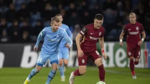 epa09603761 Daniel Graovac (C) of Cluj in action against Frederik Lauenborg (L) of Randers during the UEFA Europa Conference League soccer match between Randers FC and CFR Cluj in Randers, Denmark, 25 November 2021. EPA/Bo Amstrup DENMARK OUT