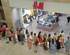 epa10104118 Russian people stand in line to enter H&M store in the Metropolis shopping mall in Moscow, Russia, 03 August 2022. H&M Group (H & M Hennes & Mauritz AB) multinational clothing company announced in July 2022 of its decision to wind down its business in Russia due to 'current operational challenges and an unpredictable future'. As part of this process the company reopens its physical stores for selling remaining stock in Russia. Earlier, in March 2022 the company paused all sales in Russia, being among some other brands which announced the suspension or limitation of their business in Russia as the result of sanctions imposed by the West on Russia in response to what the Russian President declared as a 'Special Military Operation' in Ukraine. Russian troops entered Ukraine on 24 February 2022, prompting a series of severe economic sanctions imposed by Western countries on Russia. EPA/MAXIM SHIPENKOV/Maxim Shipenkov