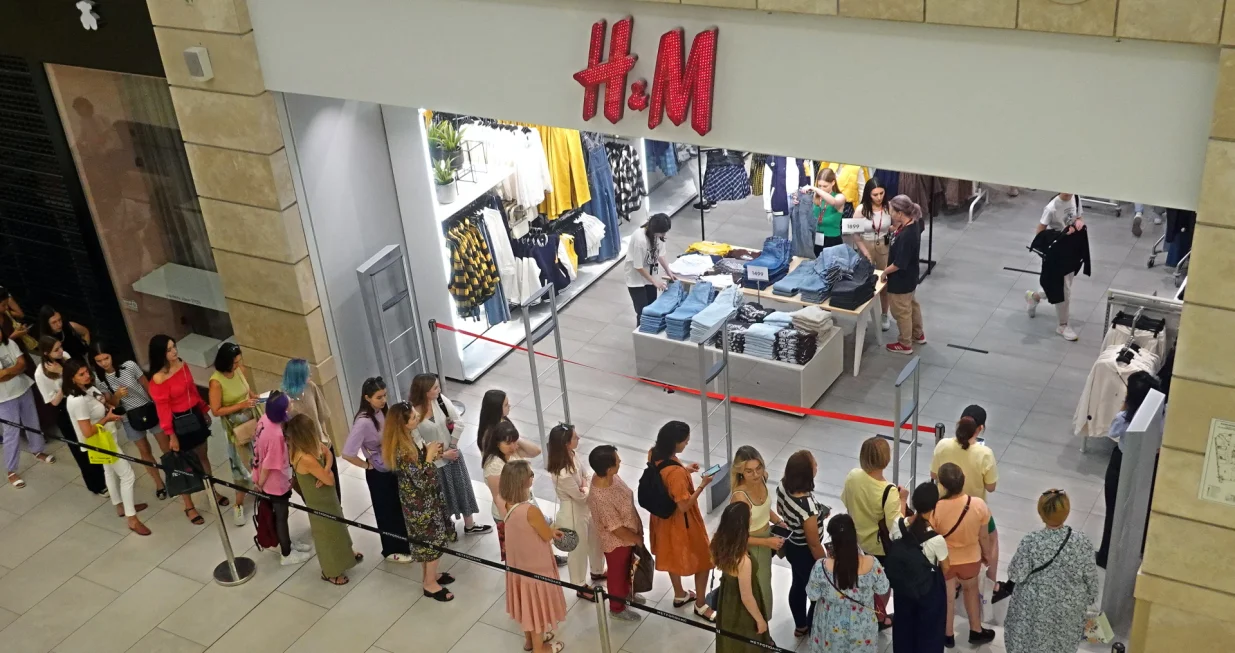 epa10104118 Russian people stand in line to enter H&M store in the Metropolis shopping mall in Moscow, Russia, 03 August 2022. H&M Group (H & M Hennes & Mauritz AB) multinational clothing company announced in July 2022 of its decision to wind down its business in Russia due to 'current operational challenges and an unpredictable future'. As part of this process the company reopens its physical stores for selling remaining stock in Russia. Earlier, in March 2022 the company paused all sales in Russia, being among some other brands which announced the suspension or limitation of their business in Russia as the result of sanctions imposed by the West on Russia in response to what the Russian President declared as a 'Special Military Operation' in Ukraine. Russian troops entered Ukraine on 24 February 2022, prompting a series of severe economic sanctions imposed by Western countries on Russia. EPA/MAXIM SHIPENKOV/Maxim Shipenkov