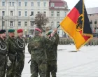 German military members hold a German flag during the inauguration of the German 45th Armored Brigade "Lietuva" in Vilnius, Lithuania May 22, 2025. REUTERS/Ints Kalnins/Ints Kalnins