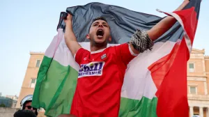 A protester holding a Palestinian flag chants slogans in front of the Greek parliament, during a rally in support to Palestinian people, amid the ongoing conflict between Israel and Hamas, in Athens, Greece, May 21, 2025. REUTERS/Louisa Gouliamaki/Louisa Gouliamaki