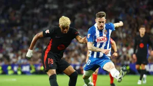 Soccer Football - LaLiga - Espanyol v FC Barcelona - RCDE Stadium, Cornella de Llobregat, Spain - May 15, 2025 FC Barcelona's Lamine Yamal in action with Espanyol's Pol Lozano REUTERS/Albert Gea