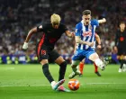 Soccer Football - LaLiga - Espanyol v FC Barcelona - RCDE Stadium, Cornella de Llobregat, Spain - May 15, 2025 FC Barcelona's Lamine Yamal in action with Espanyol's Pol Lozano REUTERS/Albert Gea