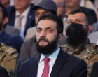 Syria's interim President Ahmed al-Sharaa looks on as he attends the "Aleppo, Key to Victory" celebration marking Syria's liberation, in Aleppo, Syria May 27, 2025. REUTERS/Khalil Ashawi/Khalil Ashawi