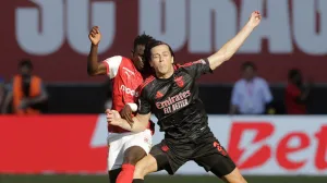 Soccer Football - Primeira Liga - S.C. Braga v Benfica - Estadio Municipal de Braga, Braga, Portugal - May 17, 2025 Benfica's Alvaro Fernandez Carreras in action with S.C. Braga's Roger Fernandes REUTERS/Miguel Vidal