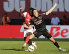 Soccer Football - Primeira Liga - S.C. Braga v Benfica - Estadio Municipal de Braga, Braga, Portugal - May 17, 2025 Benfica's Alvaro Fernandez Carreras in action with S.C. Braga's Roger Fernandes REUTERS/Miguel Vidal
