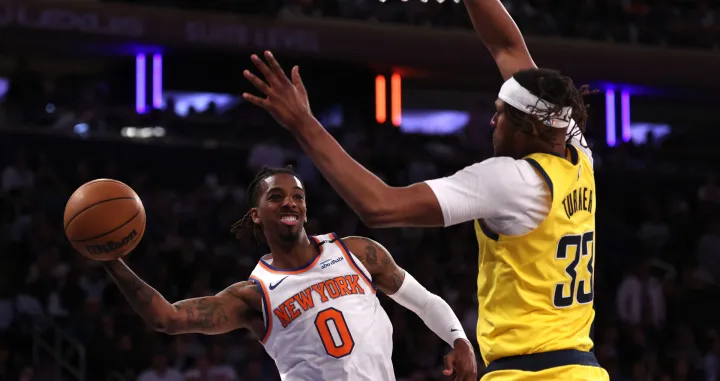 May 29, 2025; New York, New York, USA; New York Knicks guard Delon Wright (0) controls the ball against Indiana Pacers center Myles Turner (33) in the fourth quarter during game five of the eastern conference finals for the 2025 NBA Playoffs at Madison Square Garden. Mandatory Credit: Vincent Carchietta-Imagn Images