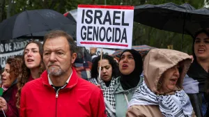 A person holds a sign during a demonstration in solidarity with Palestinians calling for a halt in arms trade and relations with Israel, in Madrid, Spain, May 10, 2025. REUTERS/Violeta Santos Moura/Violeta Santos Moura