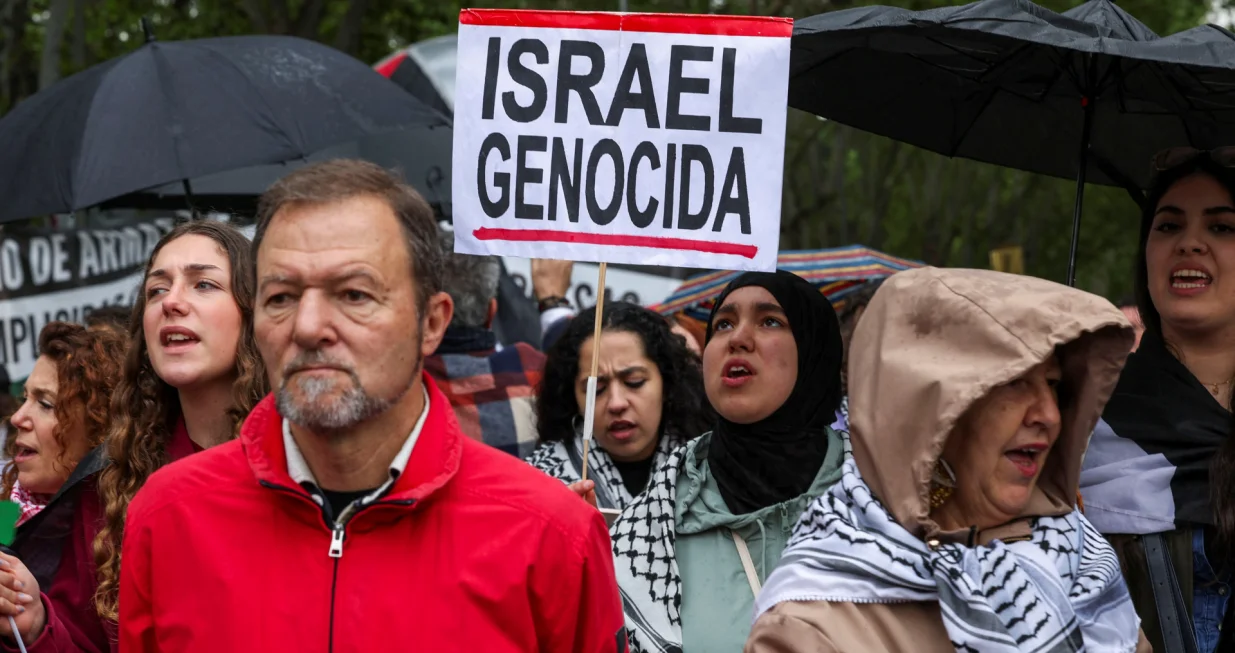 A person holds a sign during a demonstration in solidarity with Palestinians calling for a halt in arms trade and relations with Israel, in Madrid, Spain, May 10, 2025. REUTERS/Violeta Santos Moura/Violeta Santos Moura