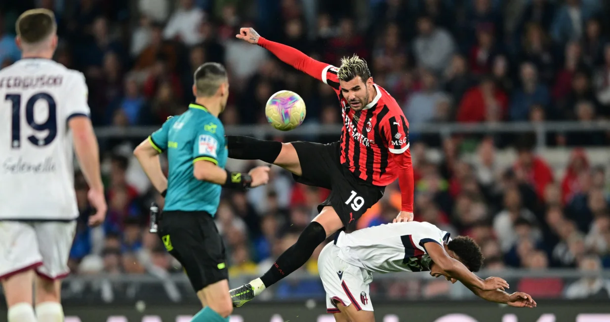 Soccer Football - Coppa Italia - Final - AC Milan v Bologna - Stadio Olimpico, Rome, Italy - May 14, 2025 AC Milan's Theo Hernandez in action with Bologna's Dan Ndoye REUTERS/Daniele Mascolo
