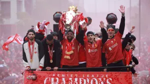Soccer Football - Premier League - Liverpool Victory Parade - Liverpool, Britain - May 26, 2025 Liverpool's Mohamed Salah celebrates with the trophy and Dominik Szoboszlai, Luis Diaz and Darwin Nunez after winning the Premier League on the bus during the Victory parade REUTERS/Phil Noble  TPX IMAGES OF THE DAY