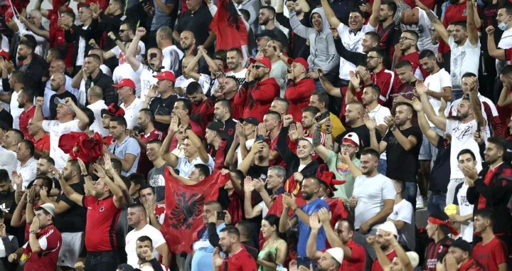 epa09449970 Fans of Albania celebrate after the FIFA World Cup 2022 qualifying soccer match between Albania and Hungary in Elbasan, Albania, 05 September 2021. EPA/MALTON DIBRA