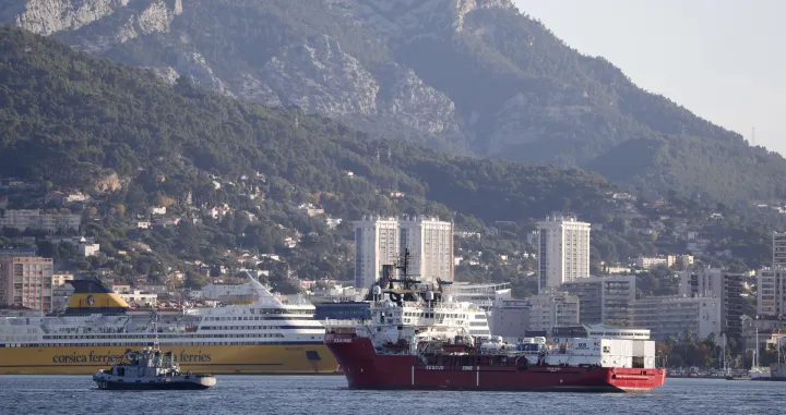 epa10299296 The Ocean Viking rescue ship (R), operated by French maritime-humanitarian organization SOS Mediterranee, enters the harbor escorted by a military boat (L), in Toulon, France, 11 November 2022. SOS Mediterranee on 10 November announced receiving the green light by French authorities to allow the over 230 migrants onboard to disembark in Toulon. The vessel spent weeks at sea after rescuing migrants during several operations throughout October. EPA/GUILLAUME HORCAJUELO/Guillaume Horcajuelo