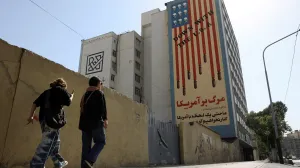 People walk past an anti-US mural on a street in Tehran, Iran, June 5, 2025. Majid Asgaripour/WANA (West Asia News Agency) via REUTERS ATTENTION EDITORS - THIS PICTURE WAS PROVIDED BY A THIRD PARTY/Majid Asgaripour