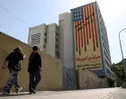 People walk past an anti-US mural on a street in Tehran, Iran, June 5, 2025. Majid Asgaripour/WANA (West Asia News Agency) via REUTERS ATTENTION EDITORS - THIS PICTURE WAS PROVIDED BY A THIRD PARTY/Majid Asgaripour