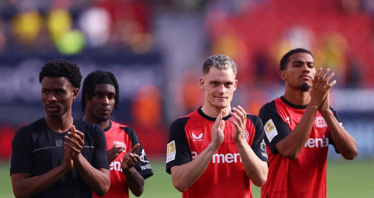 Soccer Football - Bundesliga - Bayer Leverkusen v Borussia Dortmund - BayArena, Leverkusen, Germany - May 11, 2025 Bayer Leverkusen's Florian Wirtz and Jeremie Frimpong applaud fans with teammates after the match REUTERS/Thilo Schmuelgen DFL REGULATIONS PROHIBIT ANY USE OF PHOTOGRAPHS AS IMAGE SEQUENCES AND/OR QUASI-VIDEO.