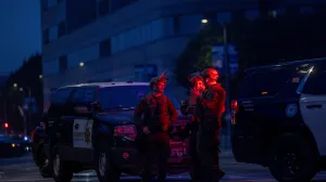 Law enforcement officers including LA County Sheriffs stand as they block off Alameda Street in front of Metropolitan Detention Center, after the California National Guard was deployed by U.S. President Donald Trump as a response to protests against federal immigration sweeps, in downtown Los Angeles, California, U.S., June 9, 2025. REUTERS/Jill Connelly/Jill Connelly