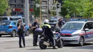Police officers stand guard near a school following a deadly school shooting in Graz, Austria, June 10, 2025. REUTERS/Leonhard Foeger/Leonhard Foeger