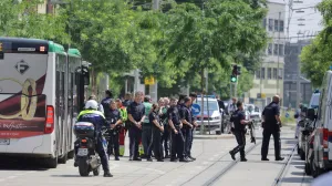 Police officers stand guard near a school following a deadly school shooting in Graz, Austria, June 10, 2025. REUTERS/Leonhard Foeger/Leonhard Foeger