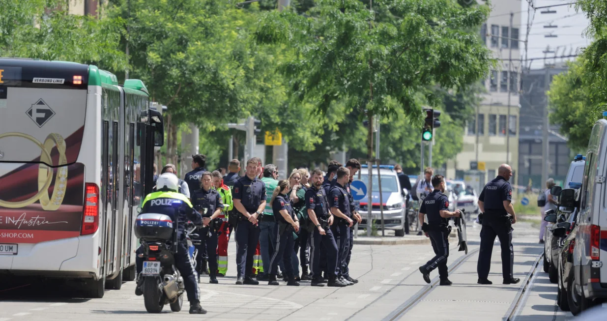 Police officers stand guard near a school following a deadly school shooting in Graz, Austria, June 10, 2025. REUTERS/Leonhard Foeger/Leonhard Foeger