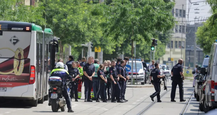 Police officers stand guard near a school following a deadly school shooting in Graz, Austria, June 10, 2025. REUTERS/Leonhard Foeger/Leonhard Foeger
