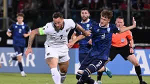 Soccer Football - World Cup - European Qualifiers - Group H - San Marino v Austria - San Marino Stadium, Serravalle, San Marino - June 10, 2025 Austria's Marko Arnautovic in action with San Marino's Tommaso Benvenuti REUTERS/Jennifer Lorenzini