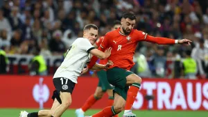 Soccer Football - Nations League - Semi Final - Germany v Portugal - Allianz Arena, Munich, Germany - June 4, 2025 Germany's Florian Wirtz in action with Portugal's Bruno Fernandes REUTERS/Kai Pfaffenbach