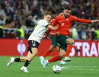 Soccer Football - Nations League - Semi Final - Germany v Portugal - Allianz Arena, Munich, Germany - June 4, 2025 Germany's Florian Wirtz in action with Portugal's Bruno Fernandes REUTERS/Kai Pfaffenbach