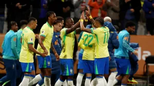 Soccer Football - World Cup - South American Qualifiers - Brazil v Paraguay - Neo Quimica Arena, Sao Paulo, Brazil - June 10, 2025 Brazil's Vinicius Junior celebrates scoring their first goal with Raphinha REUTERS/Jean Carniel