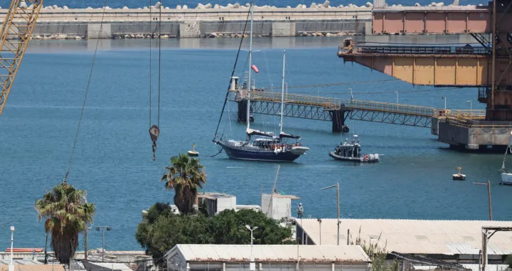 Gaza-bound British-flagged yacht "Madleen" is docked next to a military boat Ashdod port following a takeover by the Israeli army, in Ashdod, Israel, June 10, 2025. REUTERS/Nir Elias/Nir Elias