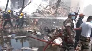 Emergency personnel work at the crash site of an Air India plane in Ahmedabad, India, June 12, 2025, in this still image taken from video. ANI/Reuters TV via REUTERS THIS IMAGE HAS BEEN SUPPLIED BY A THIRD PARTY. INDIA OUT. NO COMMERCIAL OR EDITORIAL SALES IN INDIA.  TPX IMAGES OF THE DAY/Ani