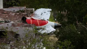A tail of an Air India Boeing 787 Dreamliner plane that crashed is seen stuck on a building after the incident in Ahmedabad, India, June 12, 2025. REUTERS/Amit Dave/Amit Dave
