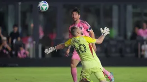 May 28, 2025; Fort Lauderdale, Florida, USA; Inter Miami CF forward Lionel Messi (10) chips the ball over CF Montreal goalkeeper Jonathan Sirois (40) and scores during the second half at Chase Stadium. Mandatory Credit: Sam Navarro-Imagn Images