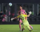 May 28, 2025; Fort Lauderdale, Florida, USA; Inter Miami CF forward Lionel Messi (10) chips the ball over CF Montreal goalkeeper Jonathan Sirois (40) and scores during the second half at Chase Stadium. Mandatory Credit: Sam Navarro-Imagn Images