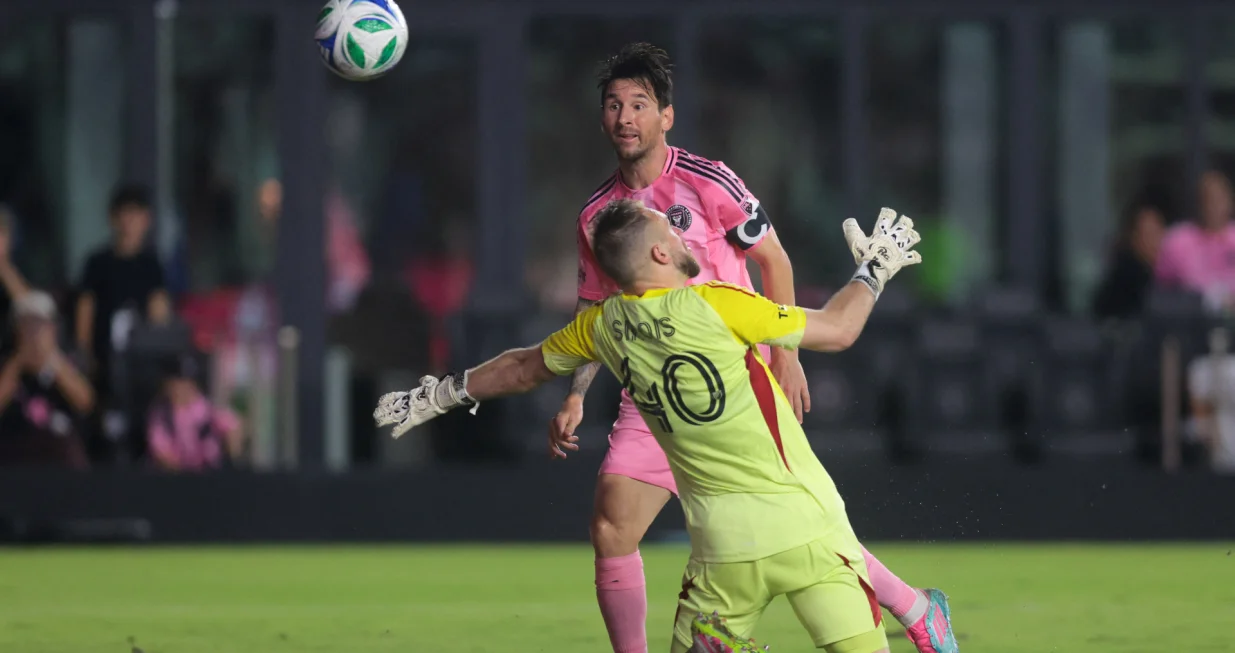 May 28, 2025; Fort Lauderdale, Florida, USA; Inter Miami CF forward Lionel Messi (10) chips the ball over CF Montreal goalkeeper Jonathan Sirois (40) and scores during the second half at Chase Stadium. Mandatory Credit: Sam Navarro-Imagn Images