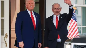 FILE PHOTO: U.S. President Donald Trump speaks as Israeli Prime Minister Benjamin Netanyahu waves following a meeting in the White House, in Washington, U.S., April 7, 2025. REUTERS/Kevin Mohatt//File Photo/Kevin Mohatt