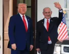 FILE PHOTO: U.S. President Donald Trump speaks as Israeli Prime Minister Benjamin Netanyahu waves following a meeting in the White House, in Washington, U.S., April 7, 2025. REUTERS/Kevin Mohatt//File Photo/Kevin Mohatt
