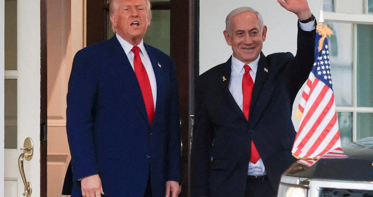 FILE PHOTO: U.S. President Donald Trump speaks as Israeli Prime Minister Benjamin Netanyahu waves following a meeting in the White House, in Washington, U.S., April 7, 2025. REUTERS/Kevin Mohatt//File Photo/Kevin Mohatt