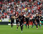 Soccer Football - Bundesliga - SC Freiburg v Eintracht Frankfurt - Europa Park Stadion, Freiburg, Germany - May 17, 2025 Eintracht Frankfurt's Hugo Ekitike and teammates celebrate after the match as Eintracht Frankfurt finish the Bundesliga season in third place to qualify for the Champions League REUTERS/Kai Pfaffenbach DFL REGULATIONS PROHIBIT ANY USE OF PHOTOGRAPHS AS IMAGE SEQUENCES AND/OR QUASI-VIDEO.