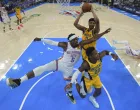 Jun 16, 2025; Oklahoma City, Oklahoma, USA; Indiana Pacers center Tony Bradley (13) rebounds over Oklahoma City Thunder guard Luguentz Dort (5) and Indiana Pacers guard Bennedict Mathurin (00) during the first half during game five of the 2025 NBA Finals at Paycom Center. Mandatory Credit: Nate Billings/Pool Photo via Imagn Images