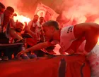 Soccer Football - DFB Cup - Final - Arminia Bielefeld v VFB Stuttgart - Olympiastadion, Berlin, Germany - May 24, 2025 VfB Stuttgart's Ermedin Demirovic celebrates with fans after winning the DFB Cup Final REUTERS/Leon Kuegeler DFB REGULATIONS PROHIBIT ANY USE OF PHOTOGRAPHS AS IMAGE SEQUENCES AND/OR QUASI-VIDEO.