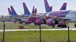 epa08313864 Nine passenger planes of the Hungarian low-cost airline WizzAir are parked at the Debrecen airport, Hungary, 22 March 2020, as the airline cut back on service due to the coronavirus COVID-19 pandemic. EPA/Zsolt Czegledi HUNGARY OUTHUNGARY OUT/Zsolt Czegledi