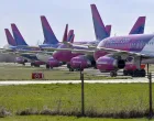epa08313864 Nine passenger planes of the Hungarian low-cost airline WizzAir are parked at the Debrecen airport, Hungary, 22 March 2020, as the airline cut back on service due to the coronavirus COVID-19 pandemic. EPA/Zsolt Czegledi HUNGARY OUTHUNGARY OUT/Zsolt Czegledi