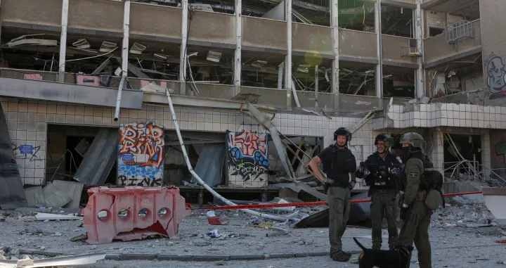 Emergency personnel work at an impact site following Iran's missile strike on Israel, amid the Iran-Israel conflict, in Haifa, Israel, June 20, 2025. REUTERS/Florion Goga/Florion Goga
