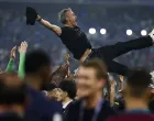 Soccer Football - Champions League - Final - Paris St Germain v Inter Milan - Allianz Arena, Munich, Germany - May 31, 2025 Paris St Germain players celebrate winning the Champions League by throwing Luis Enrique in the air REUTERS/Stephanie Lecocq