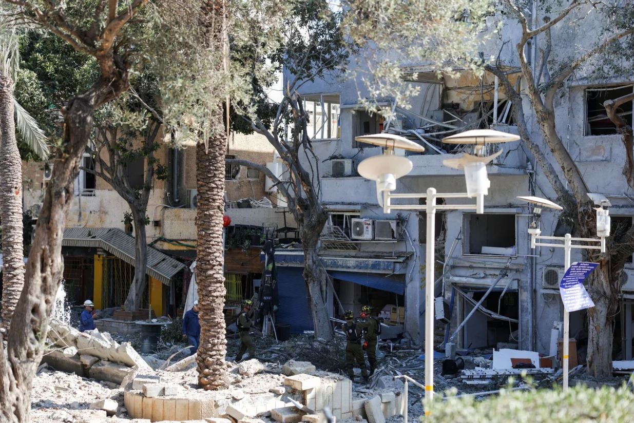 First responders gather at an impact site following Iran's strike on Israel, amid the Iran-Israel conflict, in Haifa, Israel, June 22, 2025. REUTERS/Florion Goga/Florion Goga
